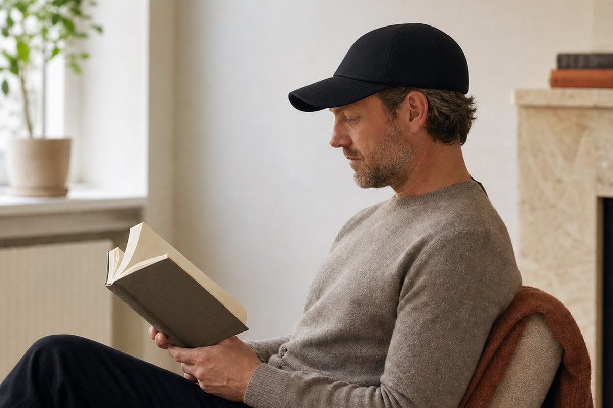 Person wearing the Resty MARS Laser Cap during a quiet hands-free routine at home