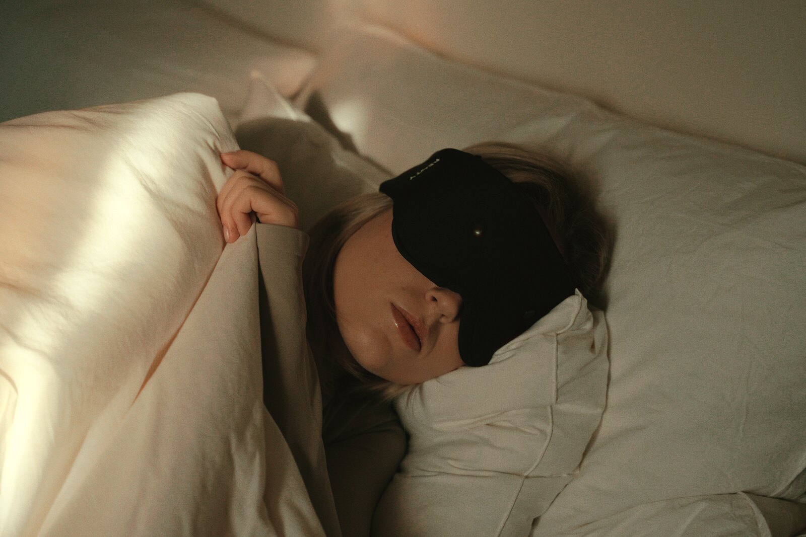 Real Resty contoured sleep mask photographed on a model