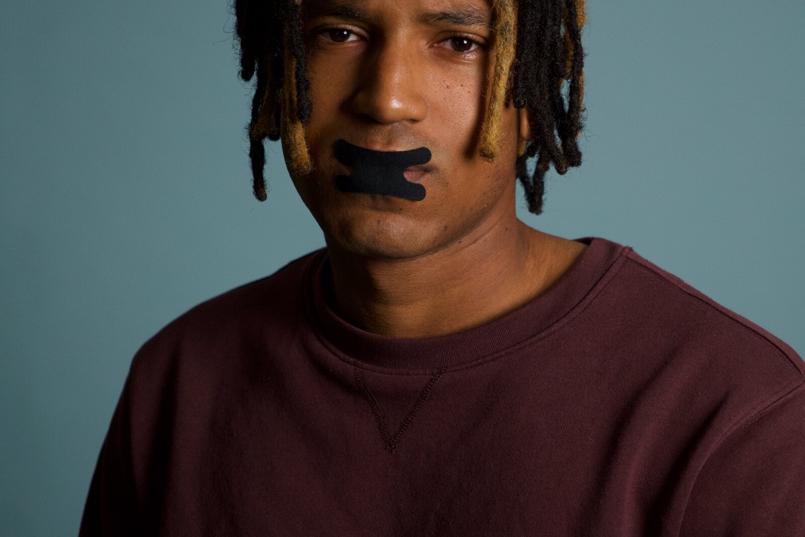 Man wearing black Resty mouth tape