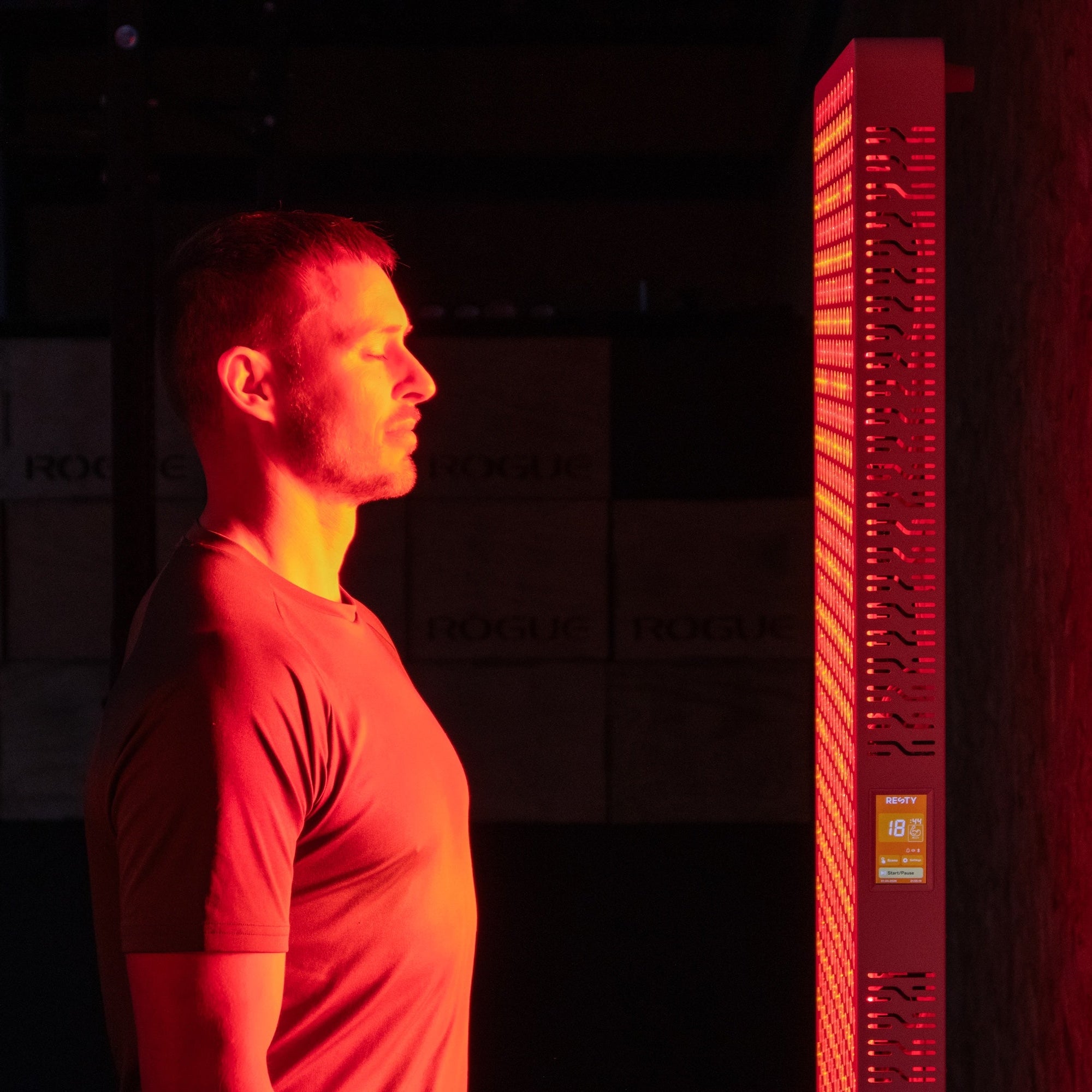 Man standing in front of an illuminated Resty MARS 2000 red light panel