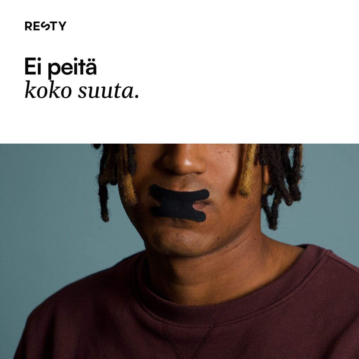 Lähikuva mustasta Advanced H-Shape -suuteipistä huulilla. Kuvan teksti: Ei peitä koko suuta.