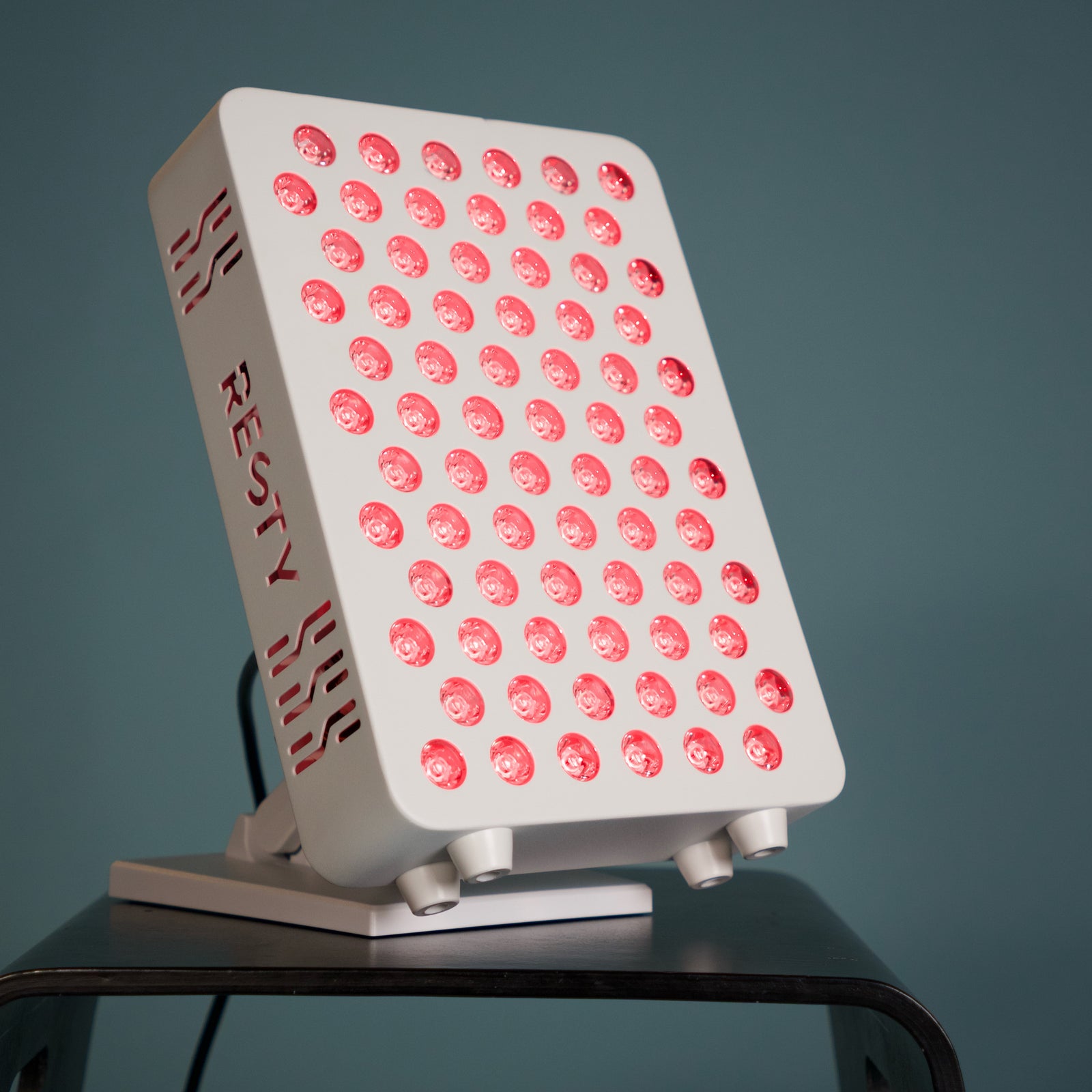 Resty MARS red light panel illuminated in a studio setting